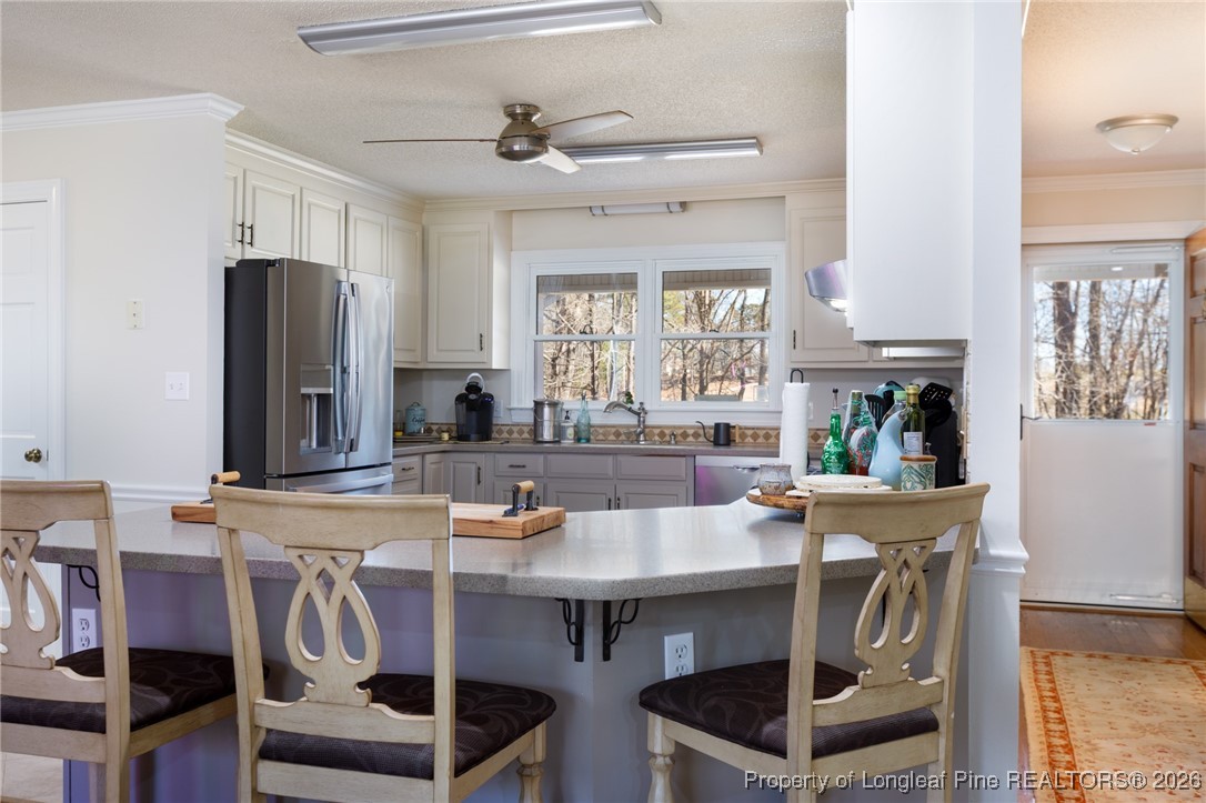 2574 Norrington Road Lillington, NC 27546 - Photo 10 of 50 a view of kitchen island table and chairs