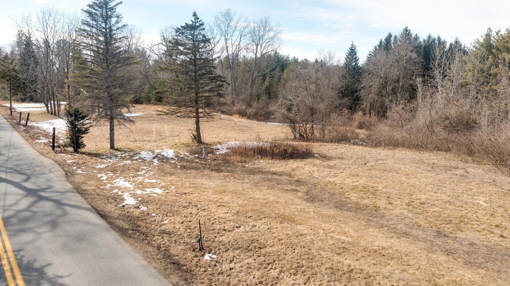 Lot 2 Chicopee Street Granby, MA 01033 - Photo 3 of 11 a view of a yard covered with snow in the background