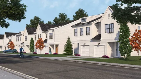 a view of street along with house and trees