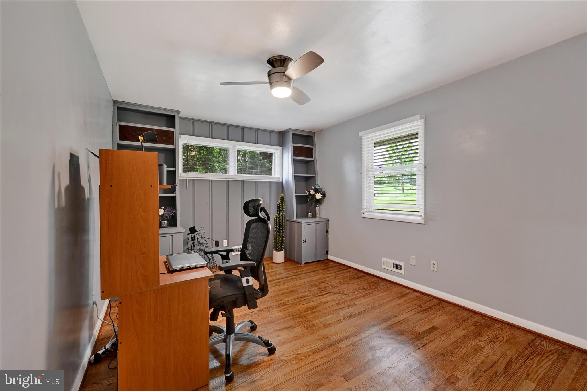 6708 Selkirk Road Baltimore, MD 21239 - Photo 18 of 30 a view of a workspace with furniture and a window