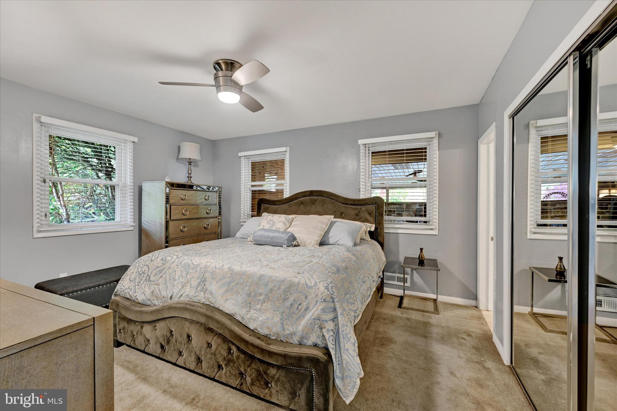 6708 Selkirk Road Baltimore, MD 21239 - Photo 19 of 30 a bedroom with a bed and wooden floor