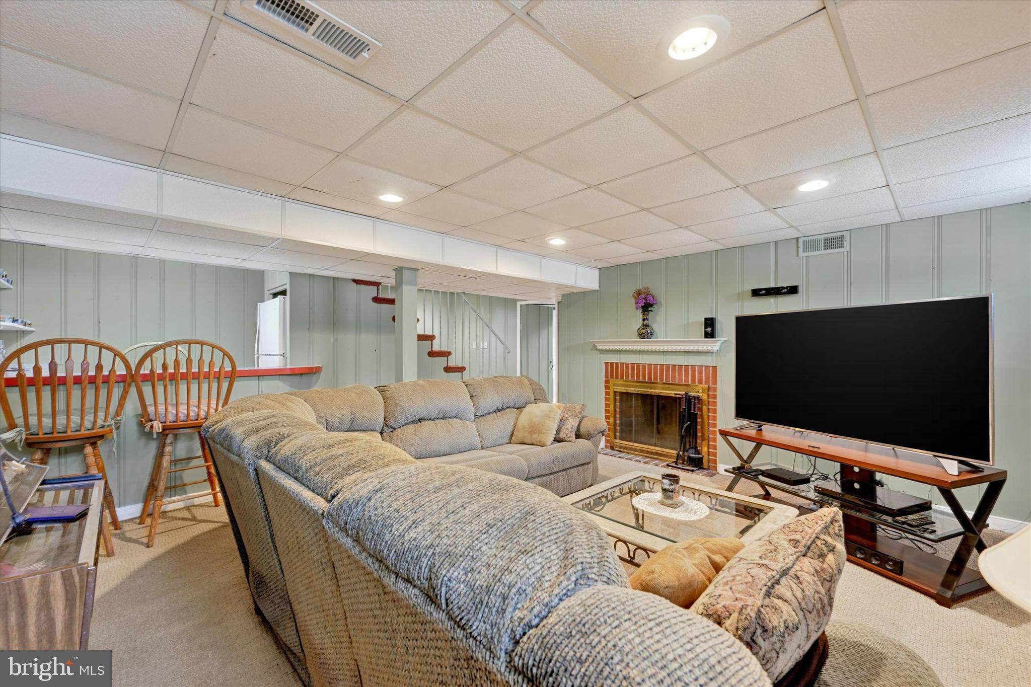 6708 Selkirk Road Baltimore, MD 21239 - Photo 23 of 30 a living room with furniture and a flat screen tv