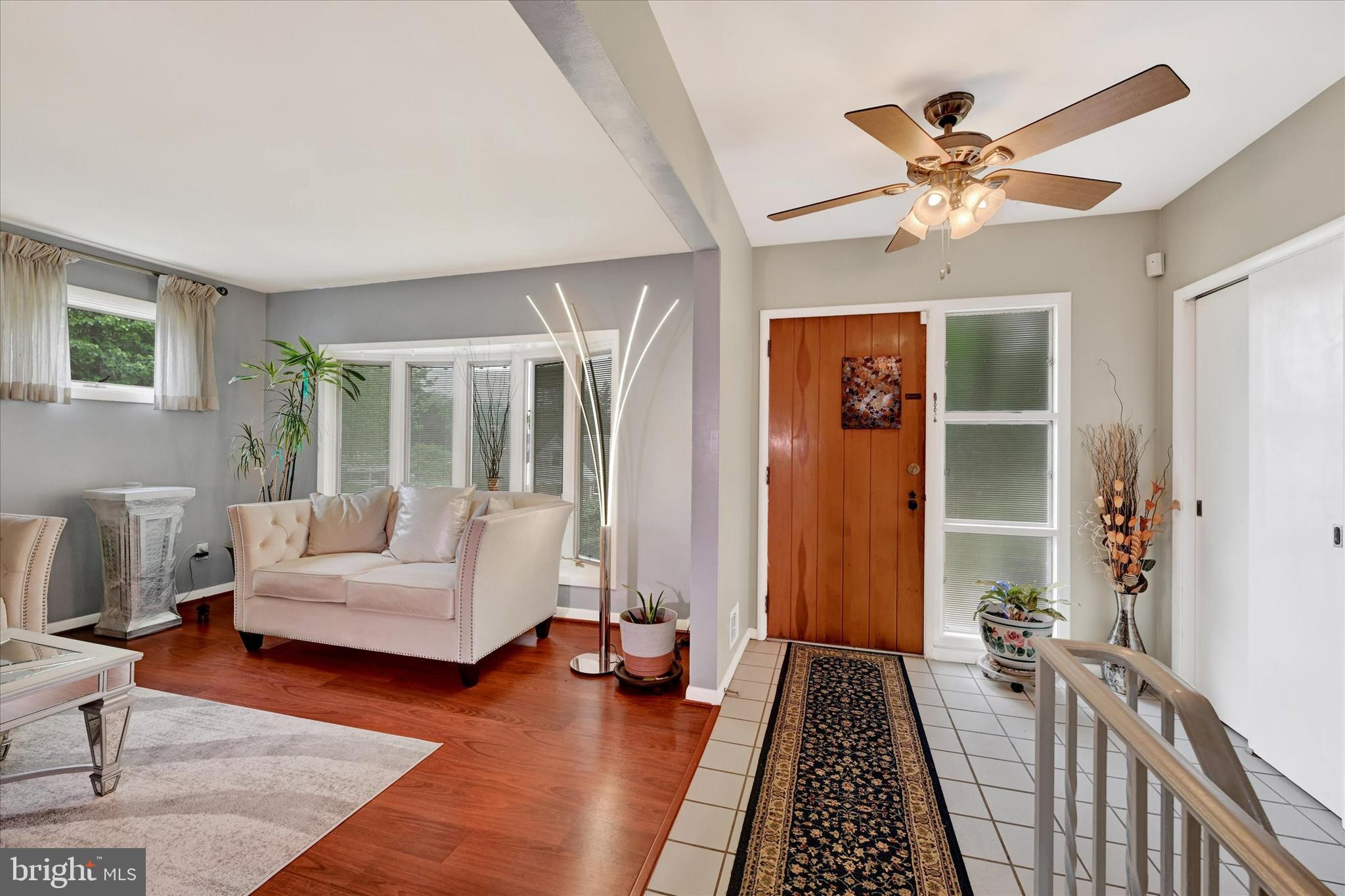6708 Selkirk Road Baltimore, MD 21239 - Photo 5 of 30 a living room with furniture and a chandelier
