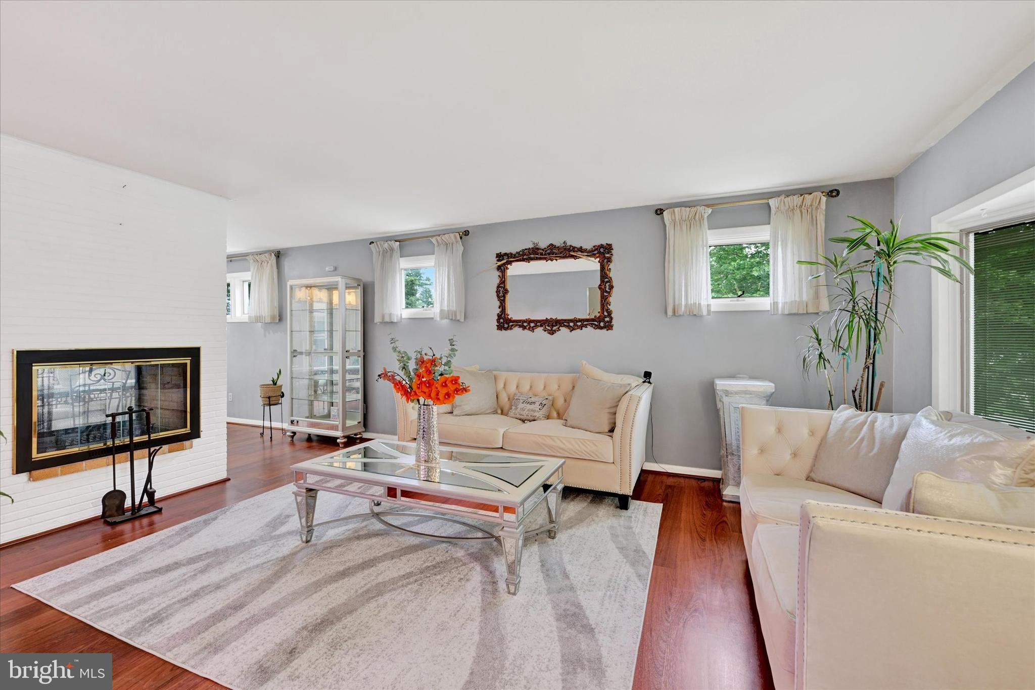 6708 Selkirk Road Baltimore, MD 21239 - Photo 6 of 30 a living room with furniture and a flat screen tv