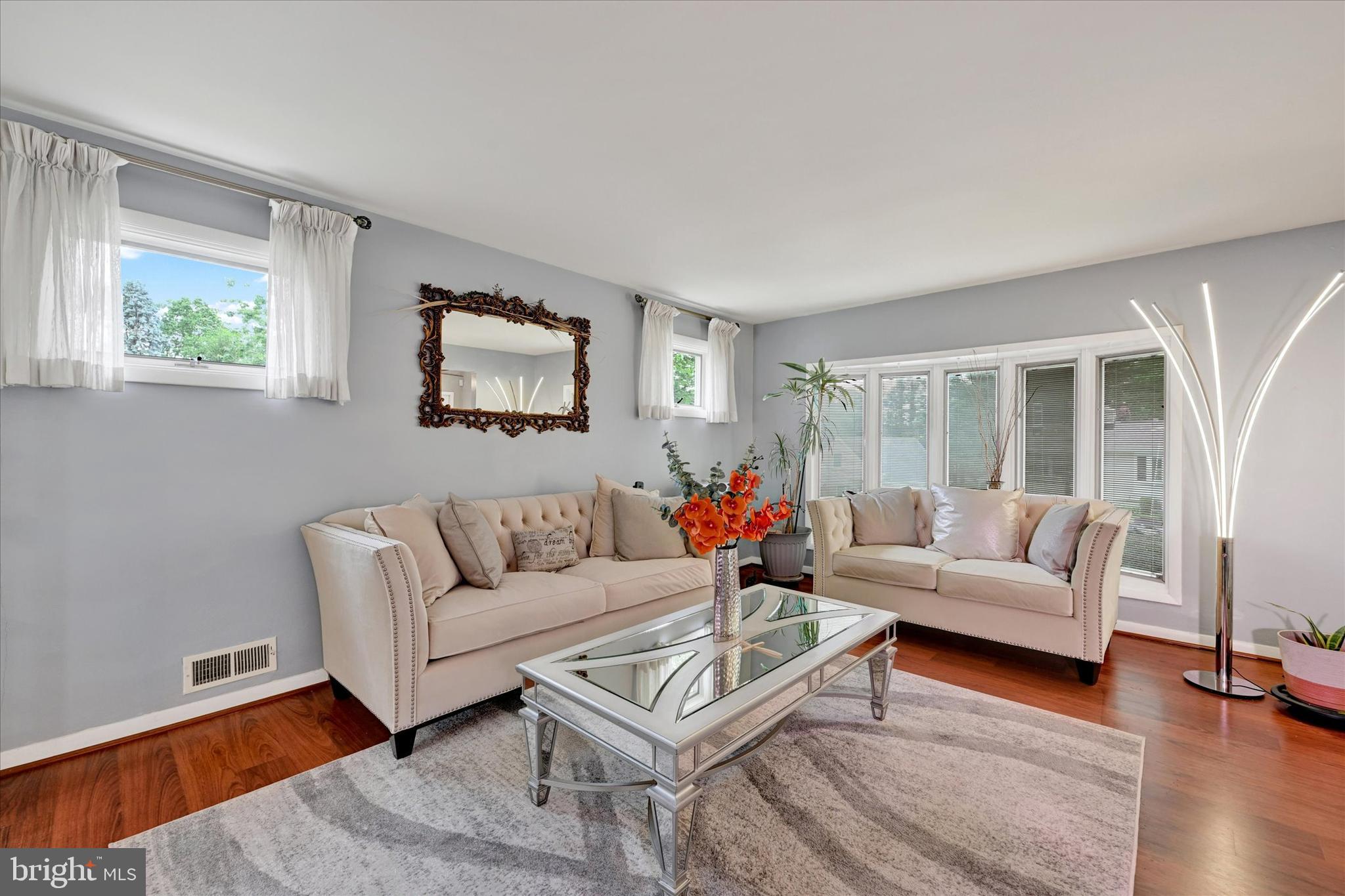 6708 Selkirk Road Baltimore, MD 21239 - Photo 7 of 30 a living room with furniture and a large window