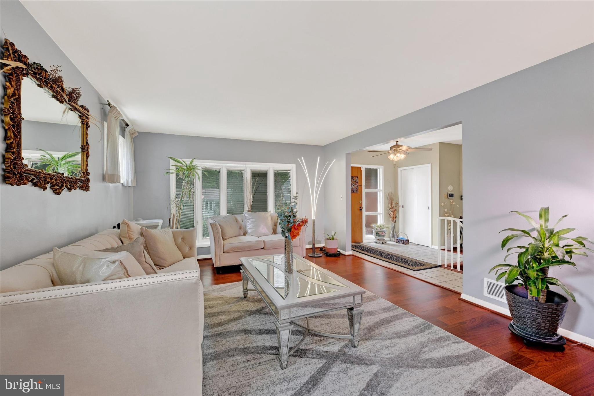 6708 Selkirk Road Baltimore, MD 21239 - Photo 8 of 30 a living room with furniture potted plant and windows