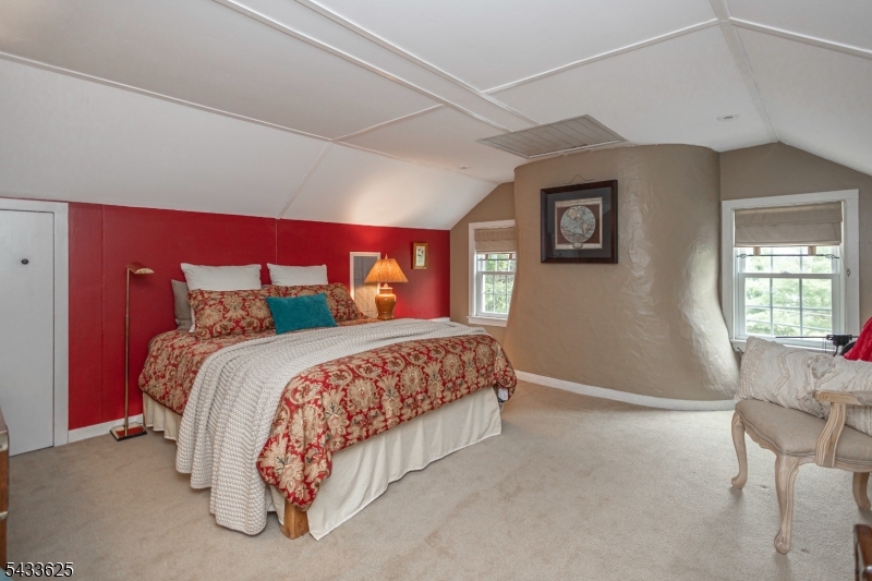 449 Stamets Road Milford, NJ 08848 - Photo 32 of 44 a bedroom with a bed and a chair