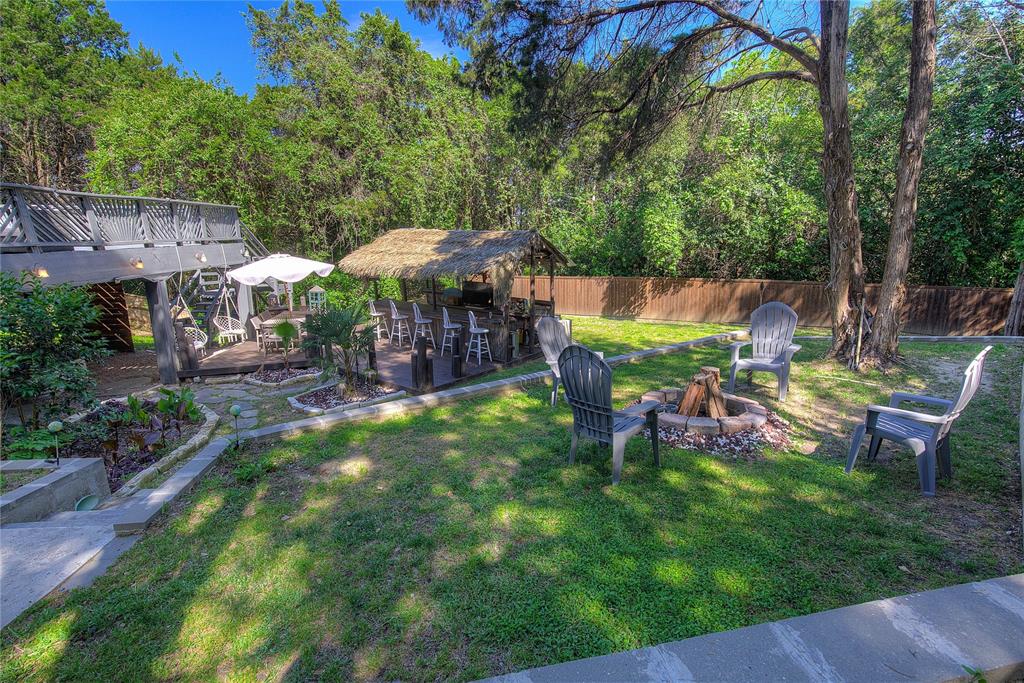 504 Summit Circle Heath, TX 75032 - Photo 35 of 39 a view of backyard with seating area and green space