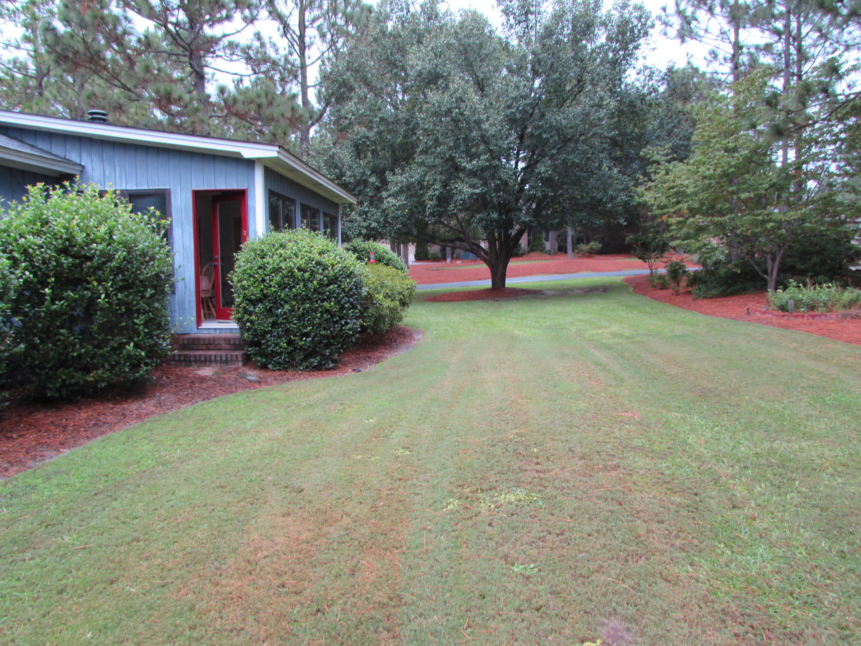 112 Sherwood Road West End, NC 27376 - Photo 4 of 17 112 Sherwood side yard from back yard