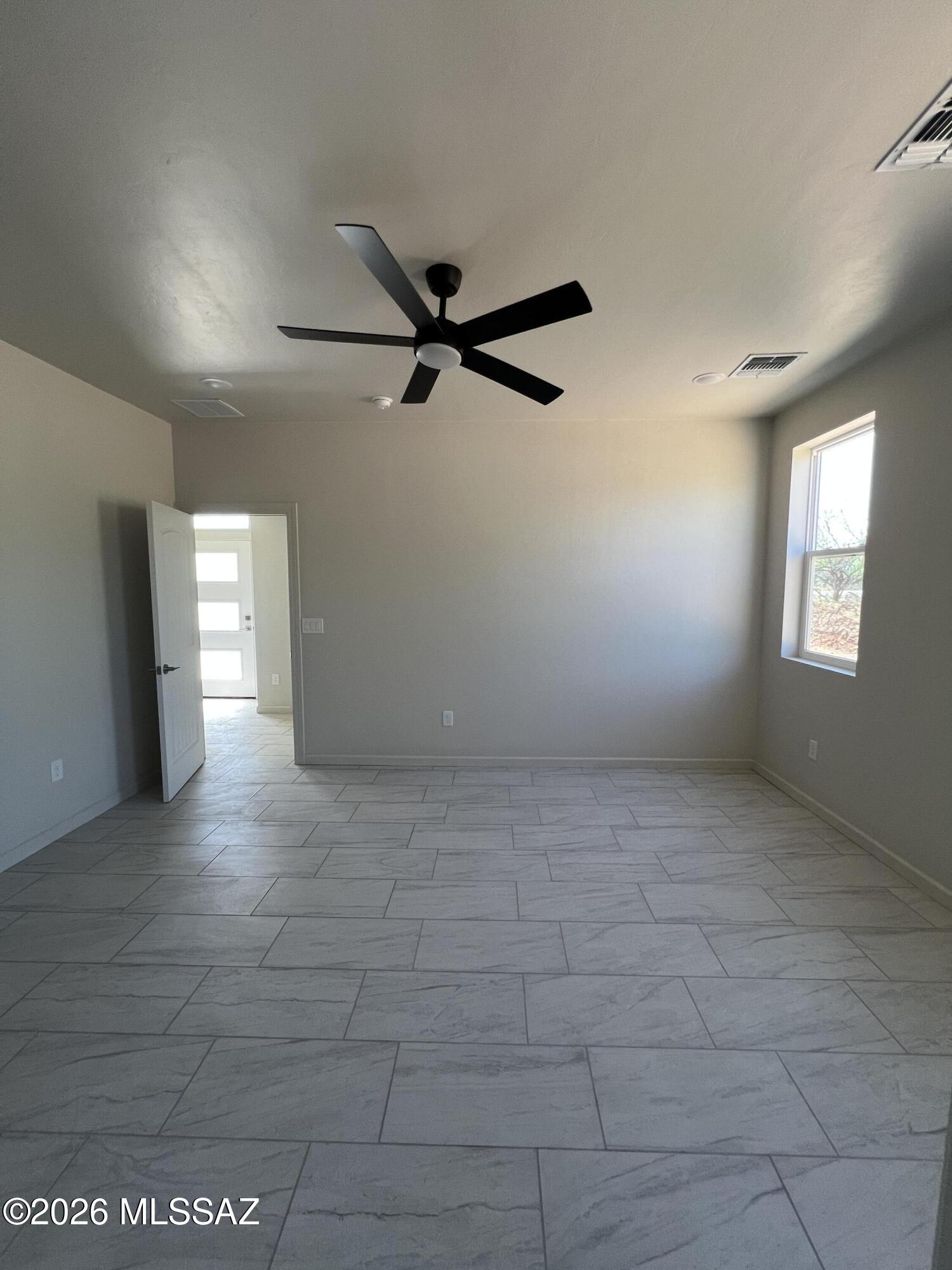 1501 Circulo Sombrero Rio Rico, AZ 85648 - Photo 21 of 26 a view of an empty room and window