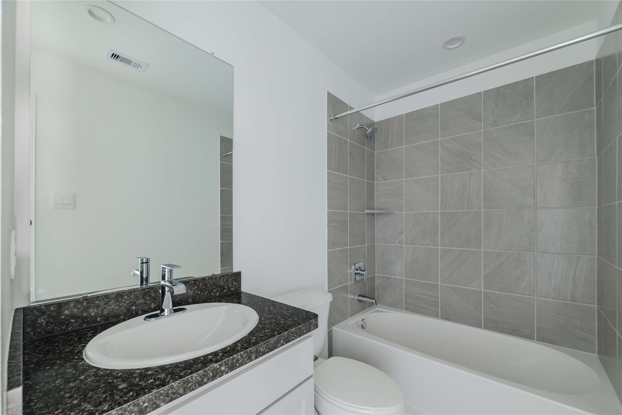 5619 Simcrest Grove Dr Spring Spring, TX 77373 - Photo 23 of 35 a bathroom with a sink a mirror and a bathtub