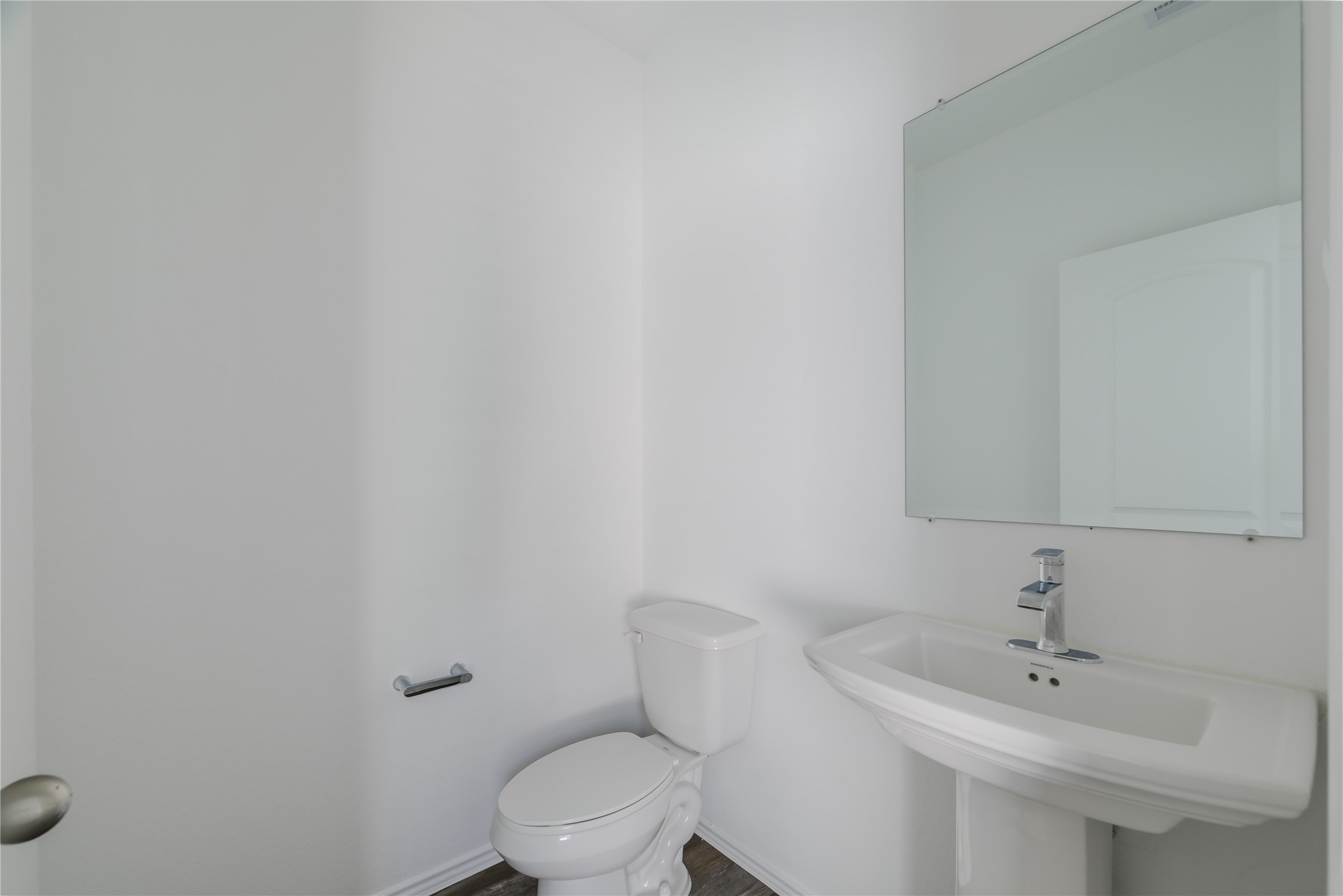 5619 Simcrest Grove Dr Spring Spring, TX 77373 - Photo 4 of 35 a bathroom with a sink a toilet and mirror