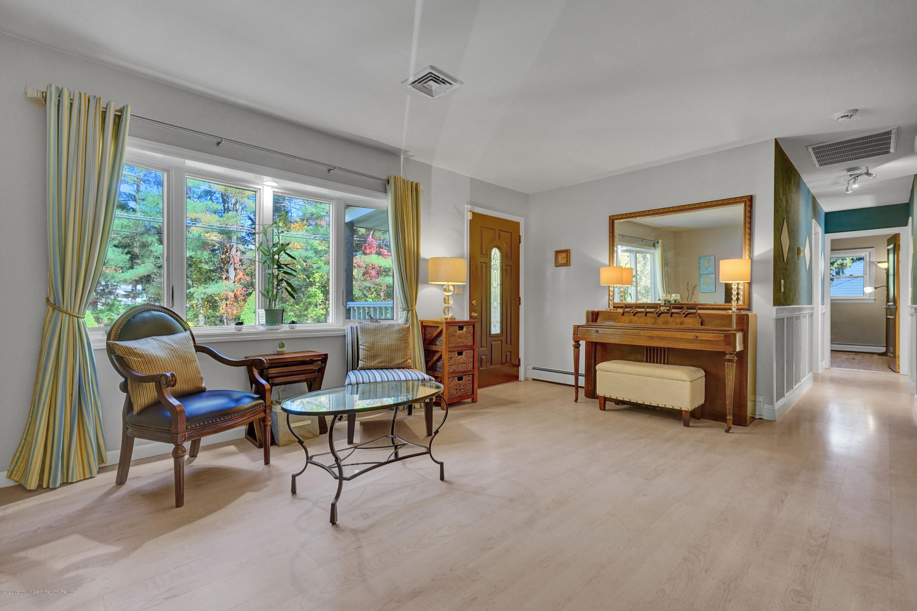 25 Harbor Road Morganville, NJ 07751 - Photo 14 of 39 a living room with furniture and a floor to ceiling window
