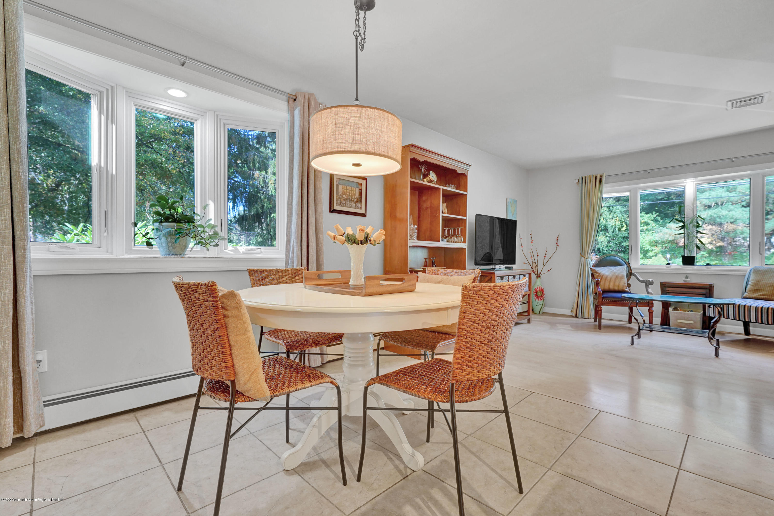25 Harbor Road Morganville, NJ 07751 - Photo 16 of 39 a dining room with furniture a chandelier and window