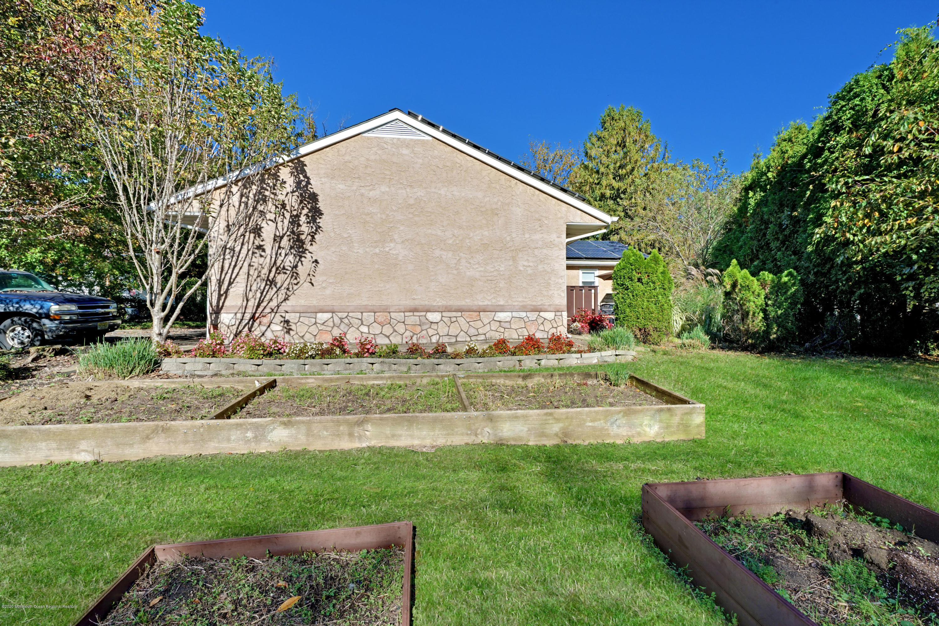 25 Harbor Road Morganville, NJ 07751 - Photo 17 of 39 a view of a house with a yard