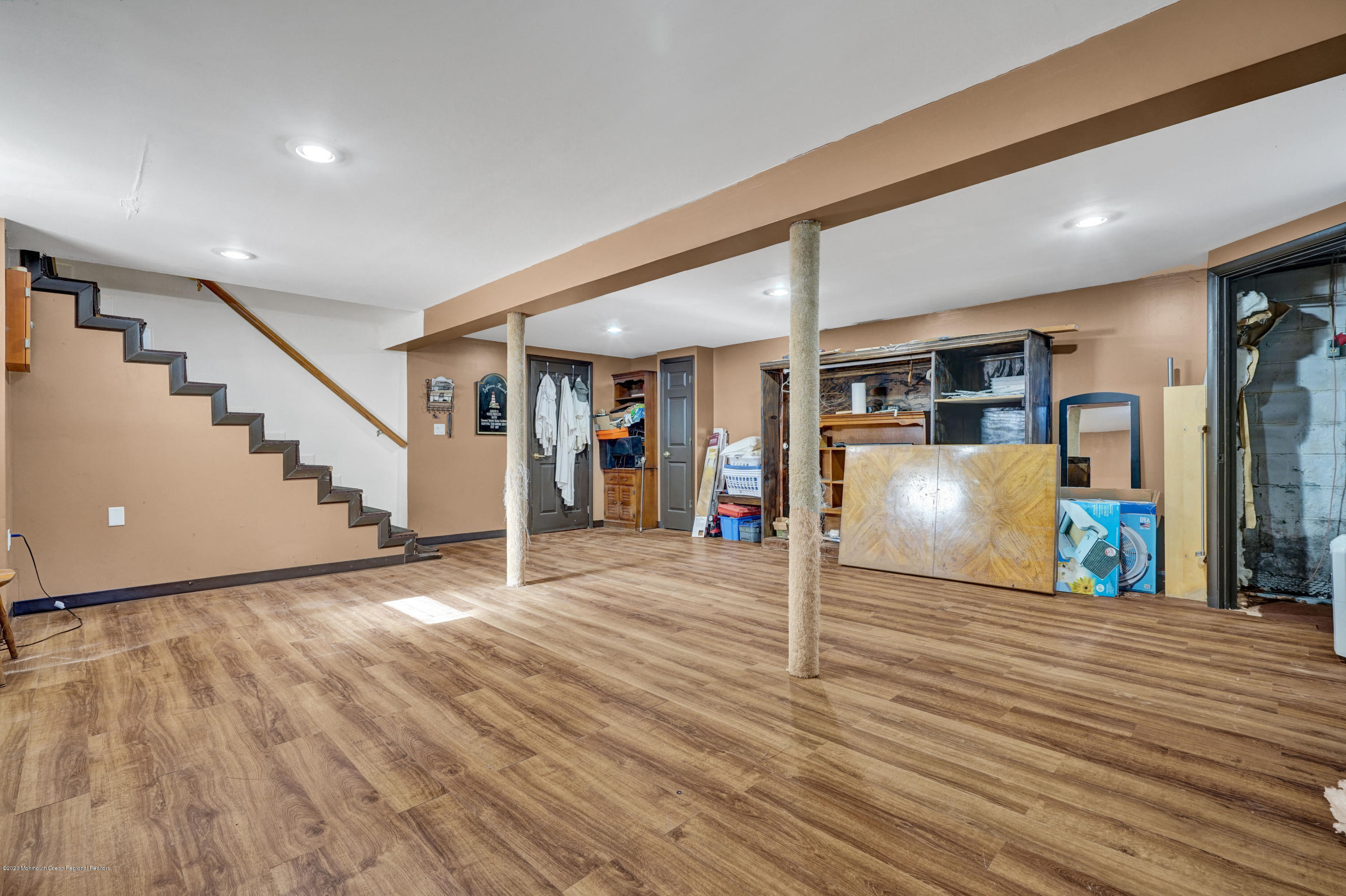 25 Harbor Road Morganville, NJ 07751 - Photo 27 of 39 a view of a room with wooden floor and stairs