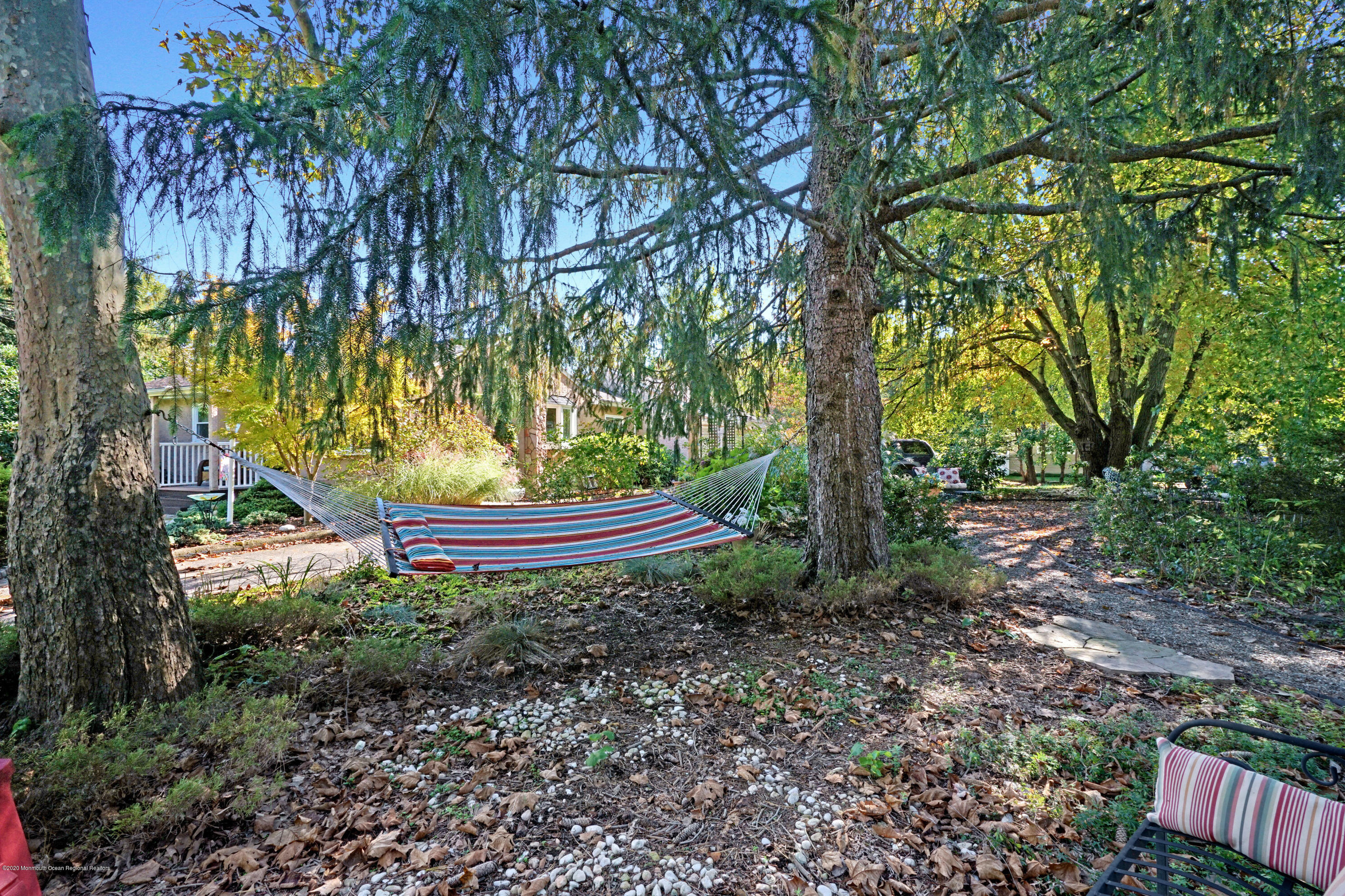 25 Harbor Road Morganville, NJ 07751 - Photo 35 of 39 a view of a garden with large trees