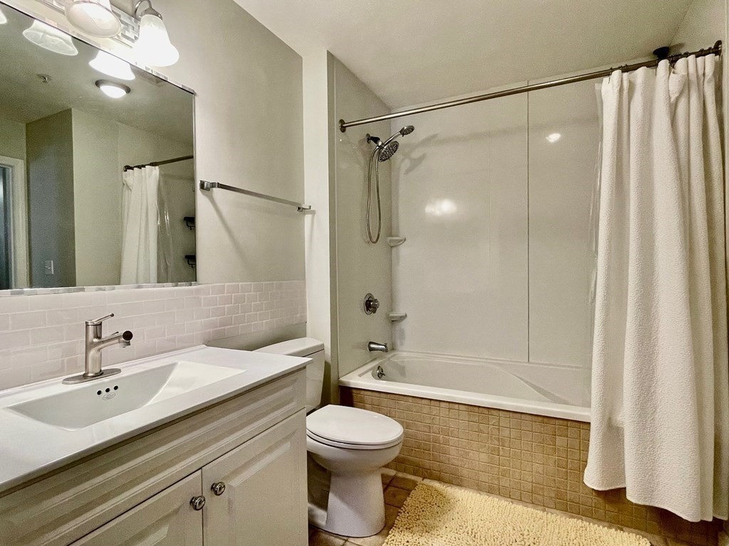 38 Village Road, Unit 208 Middleton, MA 01949 - Photo 20 of 39 a bathroom with a sink toilet and shower