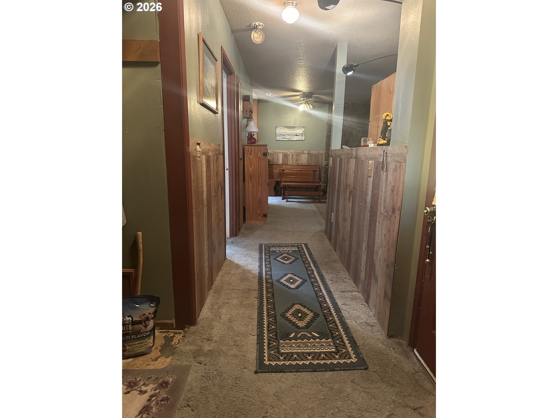 6792 Southeast Juniper Canyon Road Prineville, OR 97754 - Photo 14 of 44 a view of a hallway with wooden floor