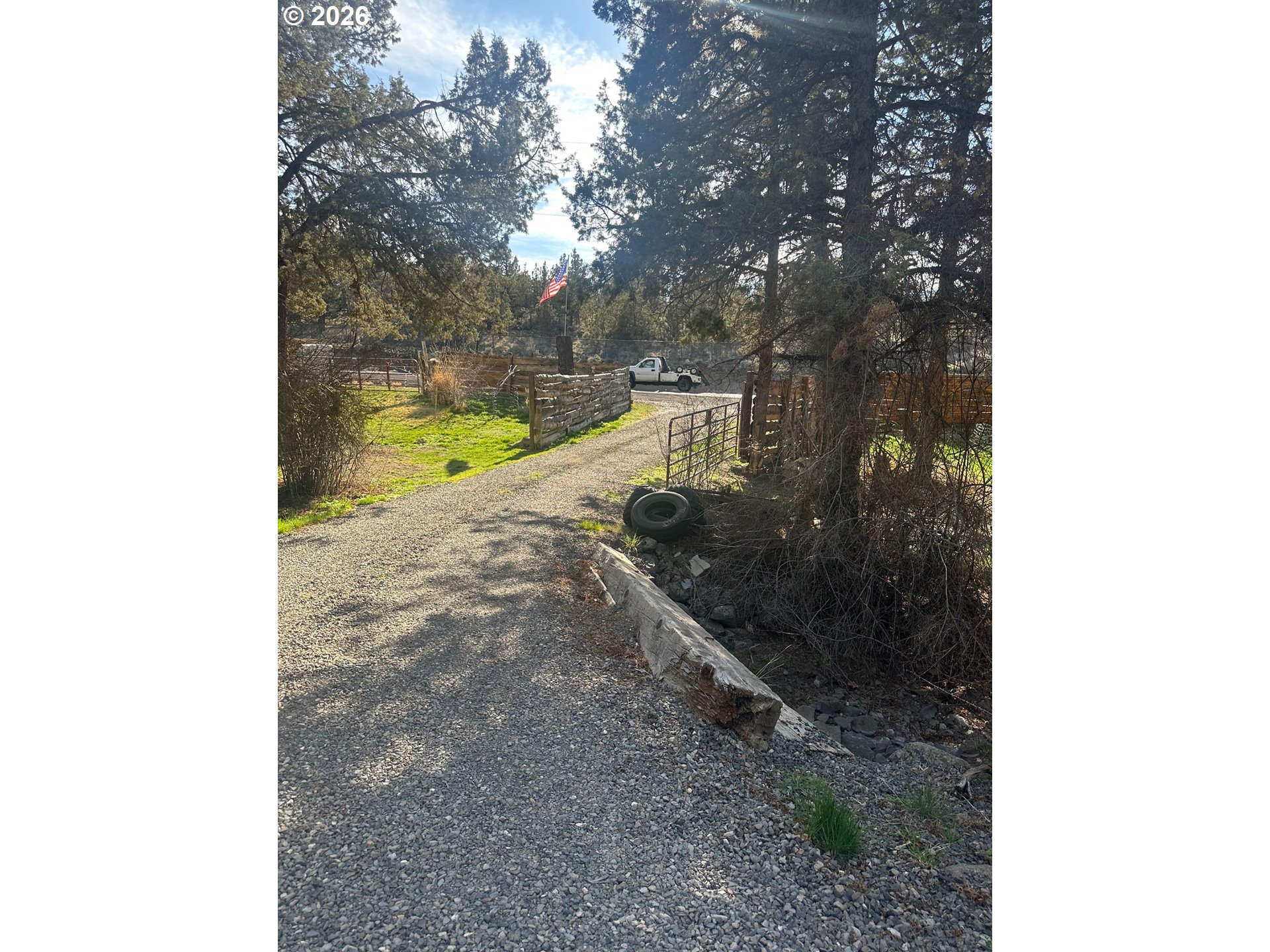 6792 Southeast Juniper Canyon Road Prineville, OR 97754 - Photo 24 of 44 a view of a yard with plants and trees