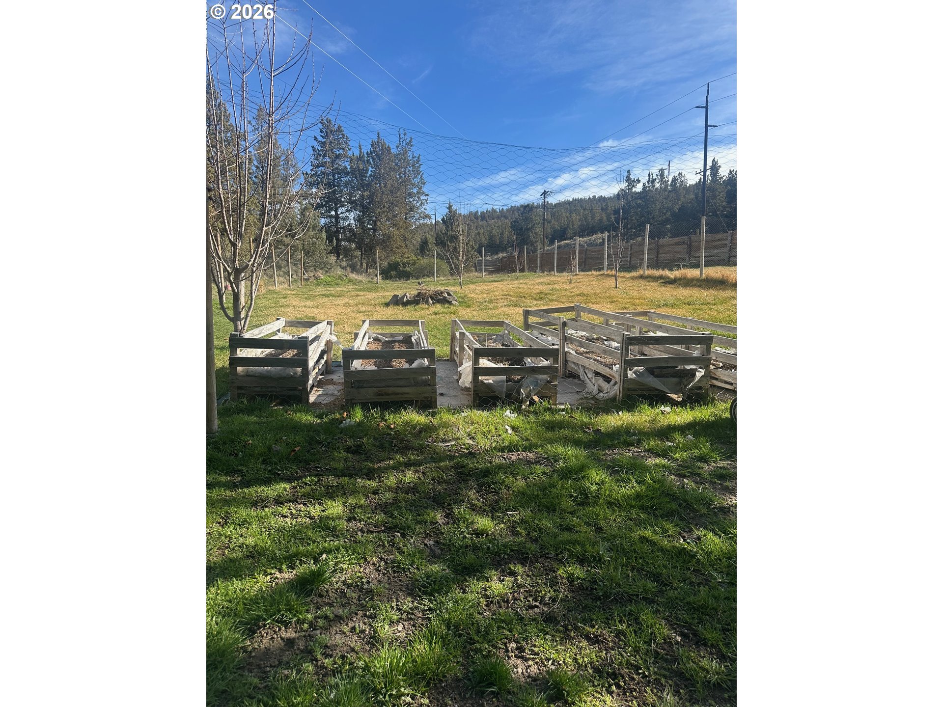 6792 Southeast Juniper Canyon Road Prineville, OR 97754 - Photo 25 of 44 a view of a yard in front of a house