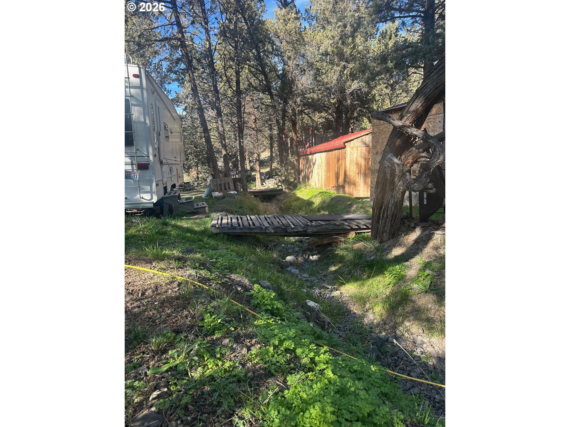 6792 Southeast Juniper Canyon Road Prineville, OR 97754 - Photo 37 of 44 a backyard of a house with lots of green space