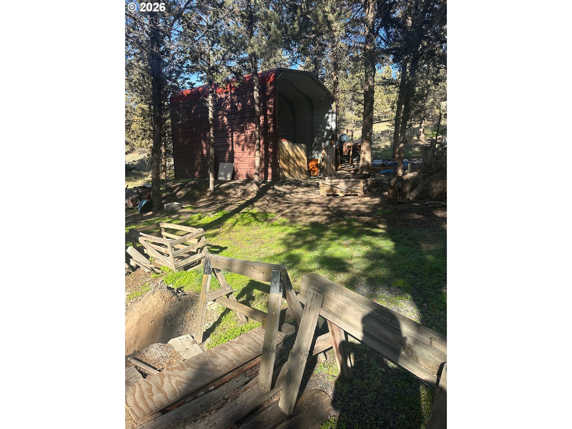 6792 Southeast Juniper Canyon Road Prineville, OR 97754 - Photo 39 of 44 a living room with furniture and a tree