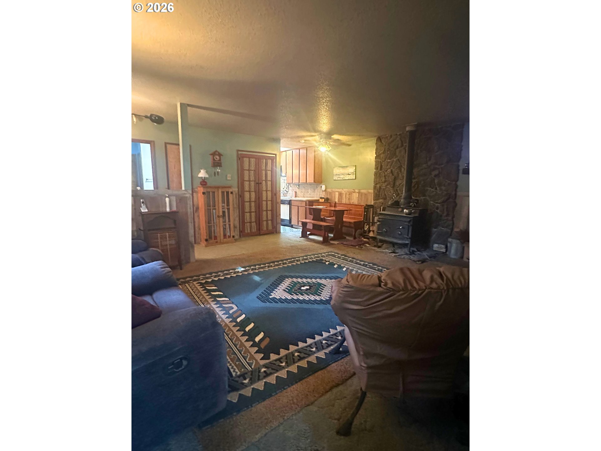 6792 Southeast Juniper Canyon Road Prineville, OR 97754 - Photo 4 of 44 a living room with furniture and a rug