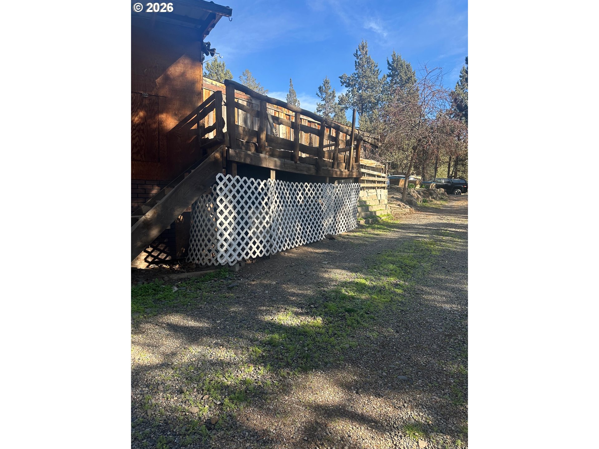 6792 Southeast Juniper Canyon Road Prineville, OR 97754 - Photo 42 of 44 a view of a house with a yard