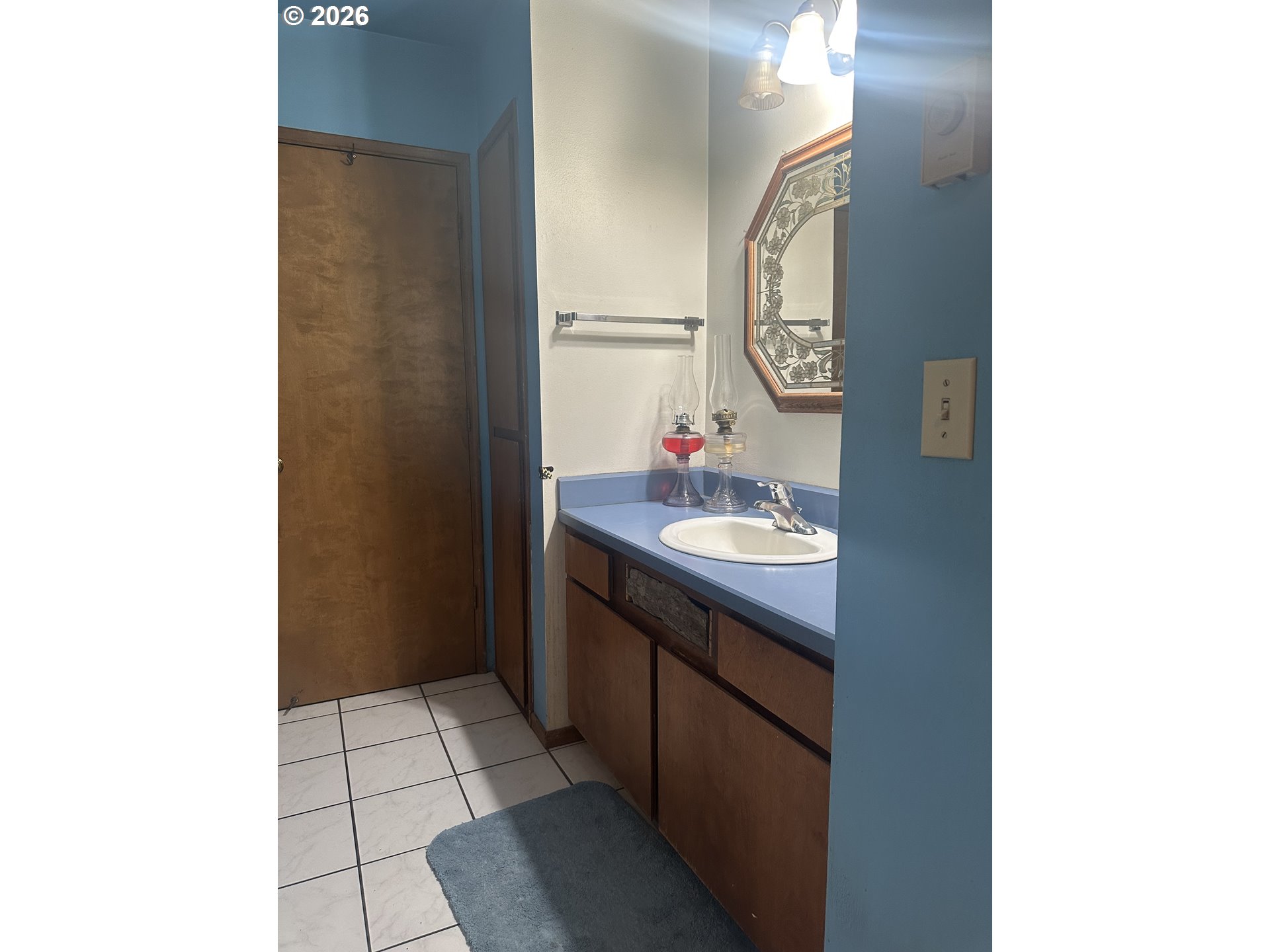 6792 Southeast Juniper Canyon Road Prineville, OR 97754 - Photo 9 of 44 a bathroom with a sink and a mirror