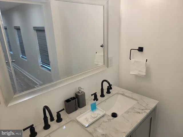 a bathroom with a shower a toilet and a sink