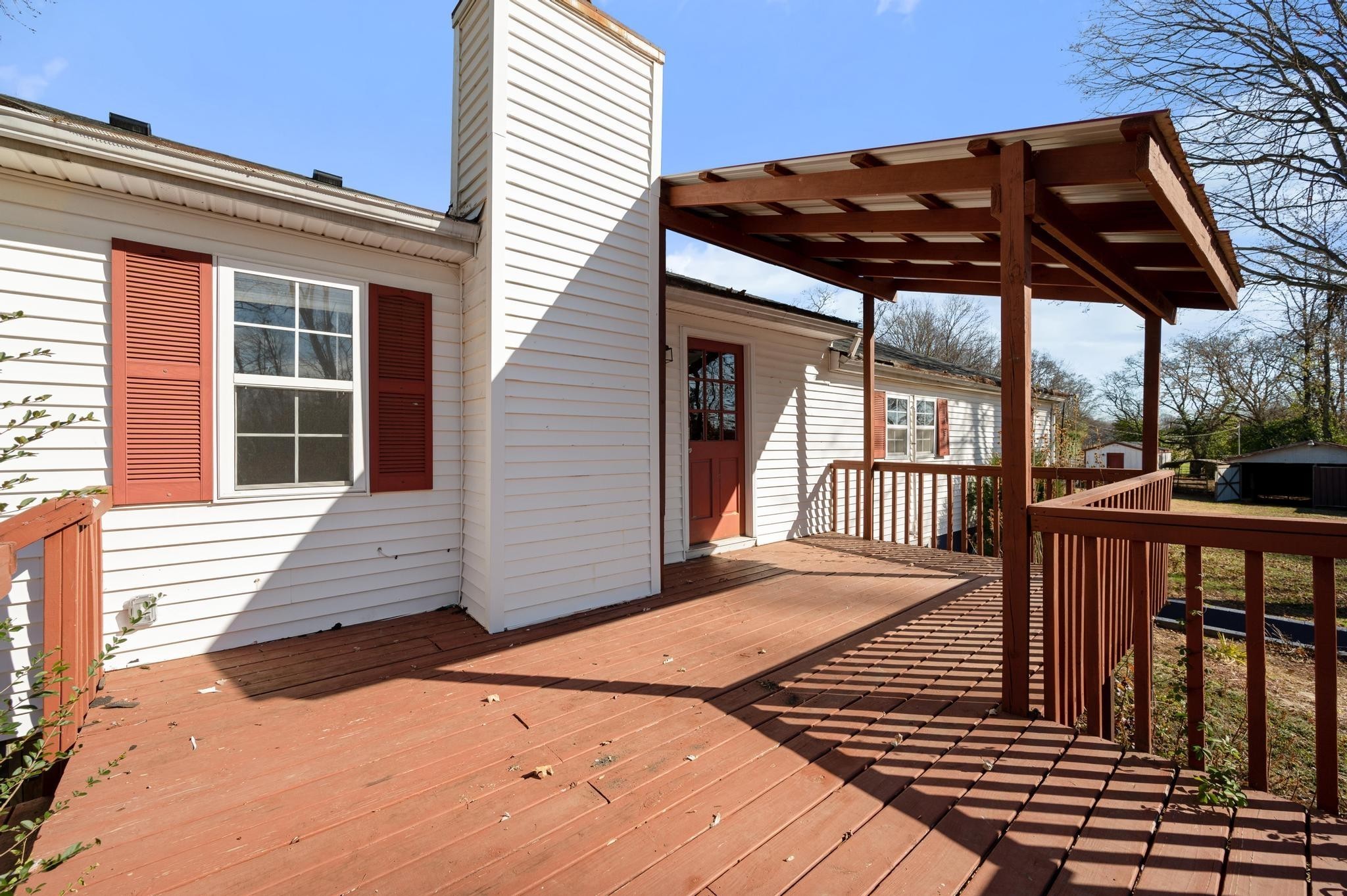 621 Halltown Road Portland, TN 37148 - Photo 20 of 23 a view of a roof deck with a barbeque grill and wooden floor
