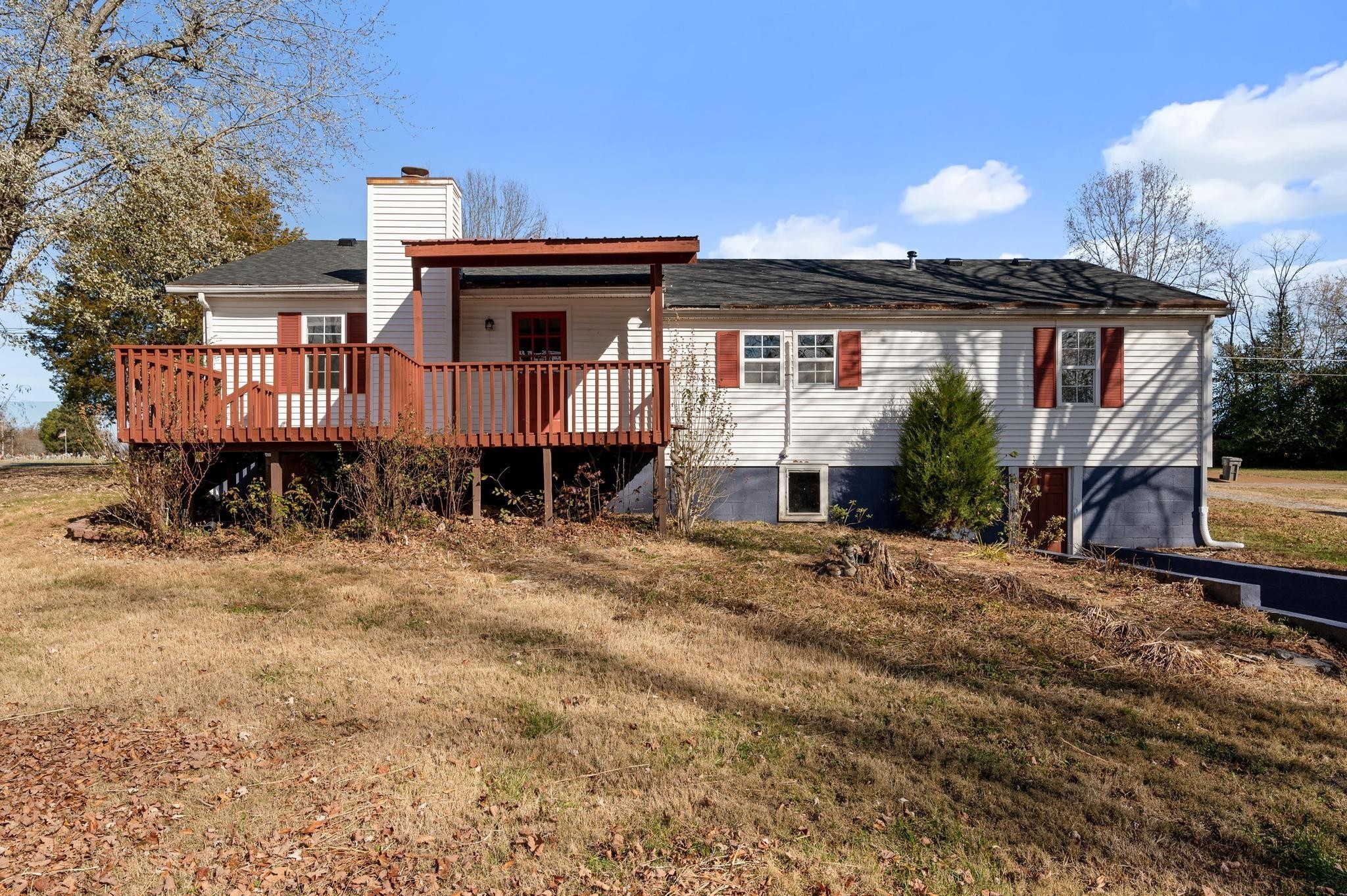 621 Halltown Road Portland, TN 37148 - Photo 21 of 23 a front view of a house with a yard and table and chairs