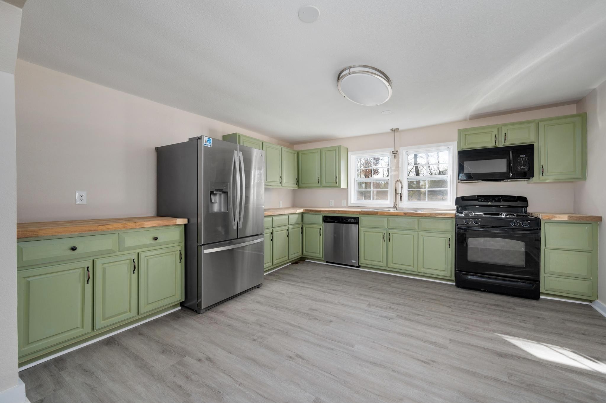 621 Halltown Road Portland, TN 37148 - Photo 6 of 23 a kitchen with a sink cabinets and stainless steel appliances