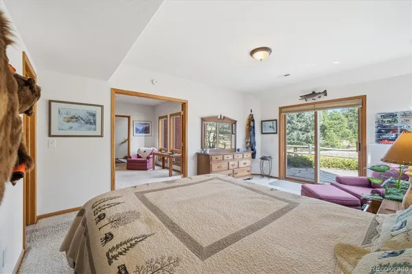 a bed room with a bed and a large window