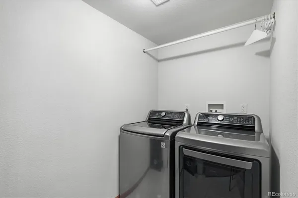a view of storage and utility room with washer and dryer