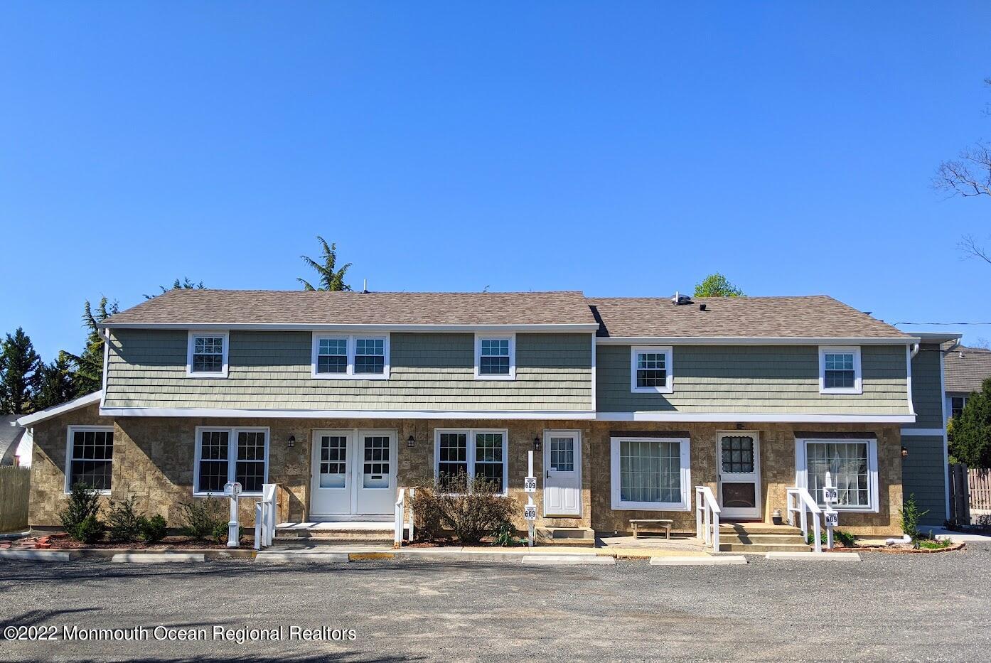 609 Higgins Avenue, Unit 3 Brielle, NJ 08730 - Photo 1 of 25 a front view of a building with street view