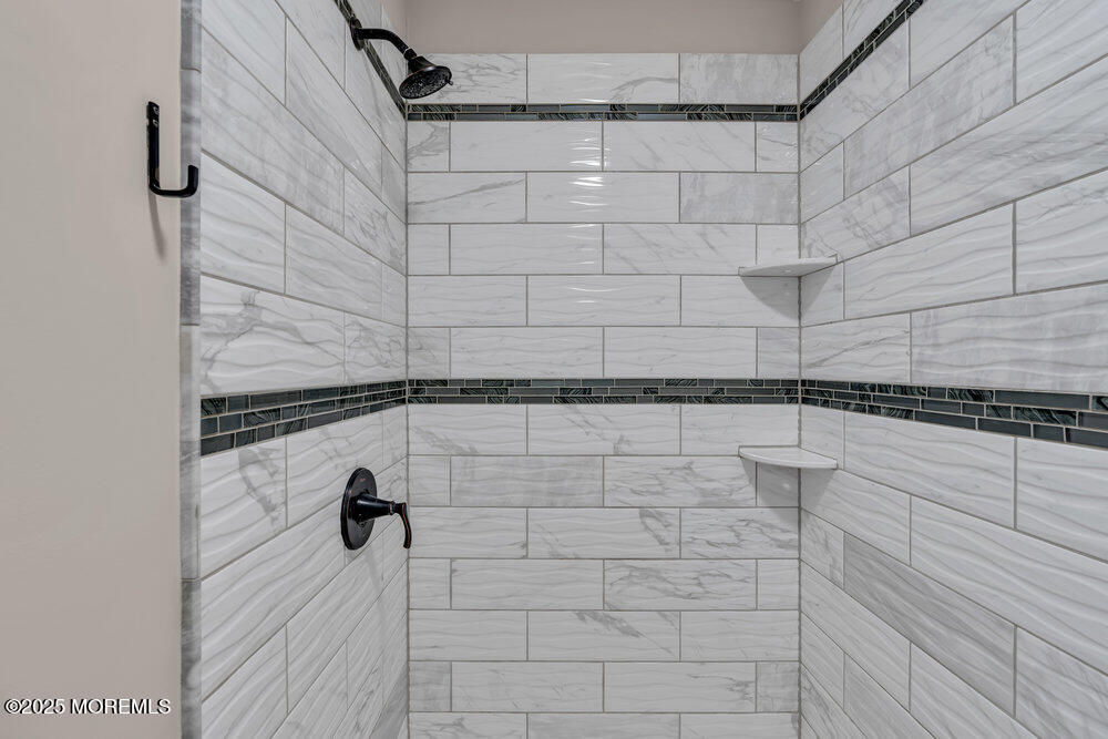 609 Higgins Avenue, Unit 3 Brielle, NJ 08730 - Photo 15 of 25 a bathroom with a shower
