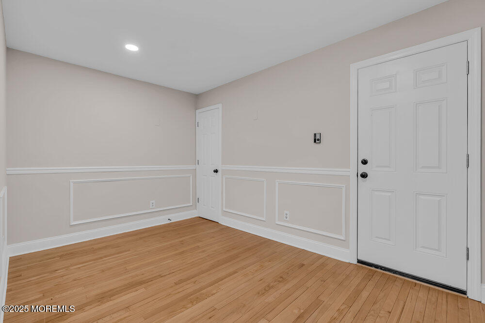 609 Higgins Avenue, Unit 3 Brielle, NJ 08730 - Photo 17 of 25 wooden floor in an empty room