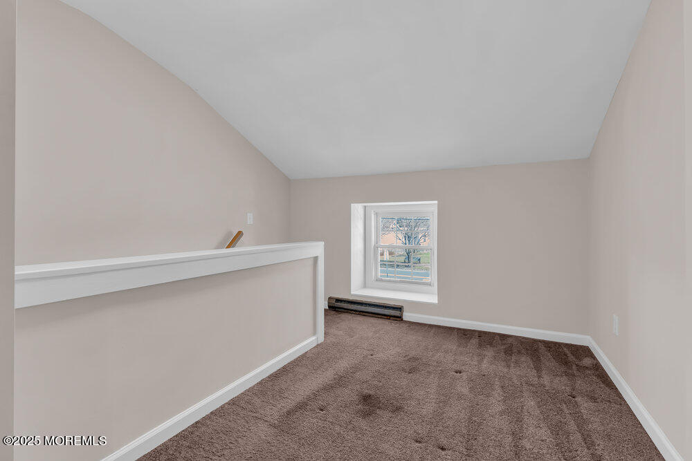 609 Higgins Avenue, Unit 3 Brielle, NJ 08730 - Photo 20 of 25 a view of an empty room with a window