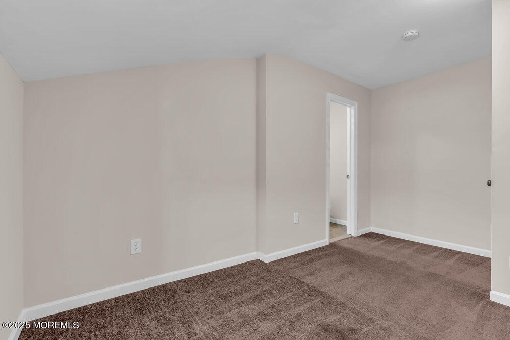 609 Higgins Avenue, Unit 3 Brielle, NJ 08730 - Photo 21 of 25 a view of an empty room