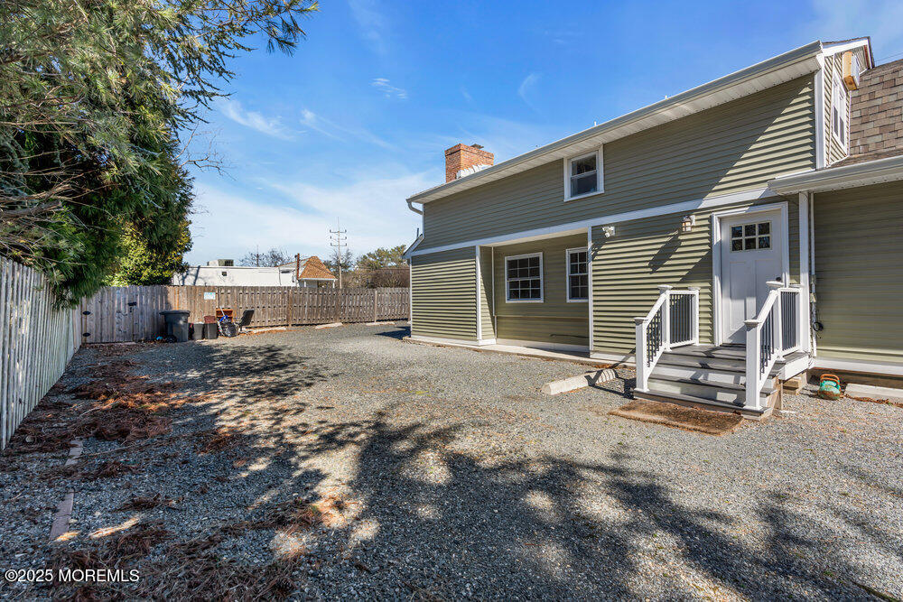 609 Higgins Avenue, Unit 3 Brielle, NJ 08730 - Photo 23 of 25 a view of a house with backyard