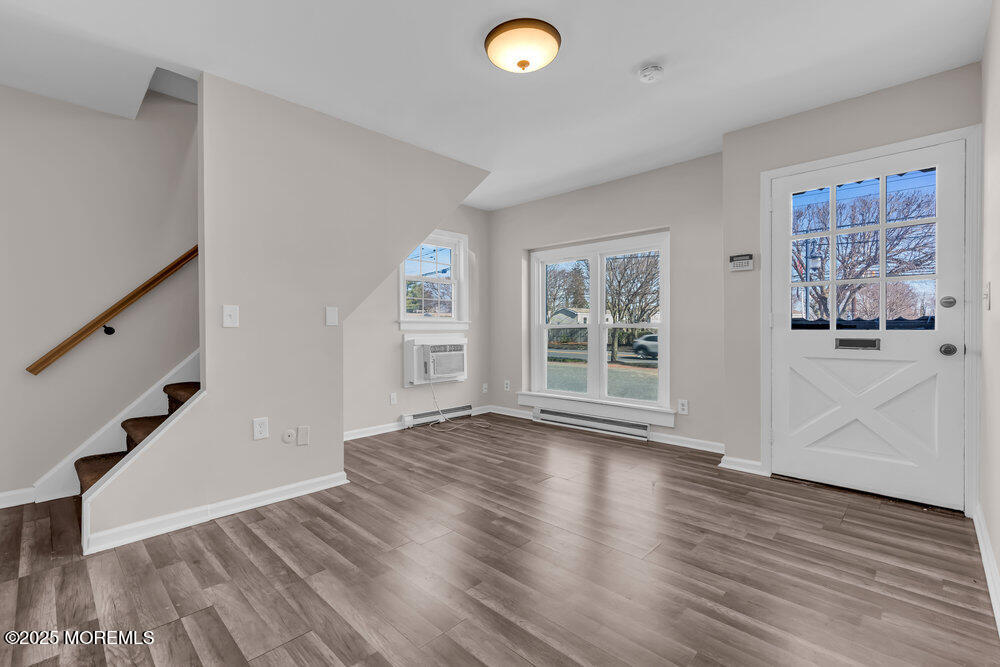 609 Higgins Avenue, Unit 3 Brielle, NJ 08730 - Photo 5 of 25 wooden floor in an empty room with a window