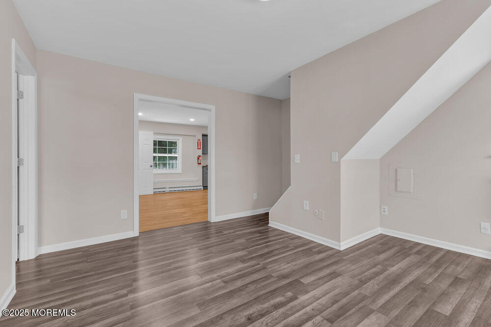 609 Higgins Avenue, Unit 3 Brielle, NJ 08730 - Photo 7 of 25 a view of empty room with wooden floor