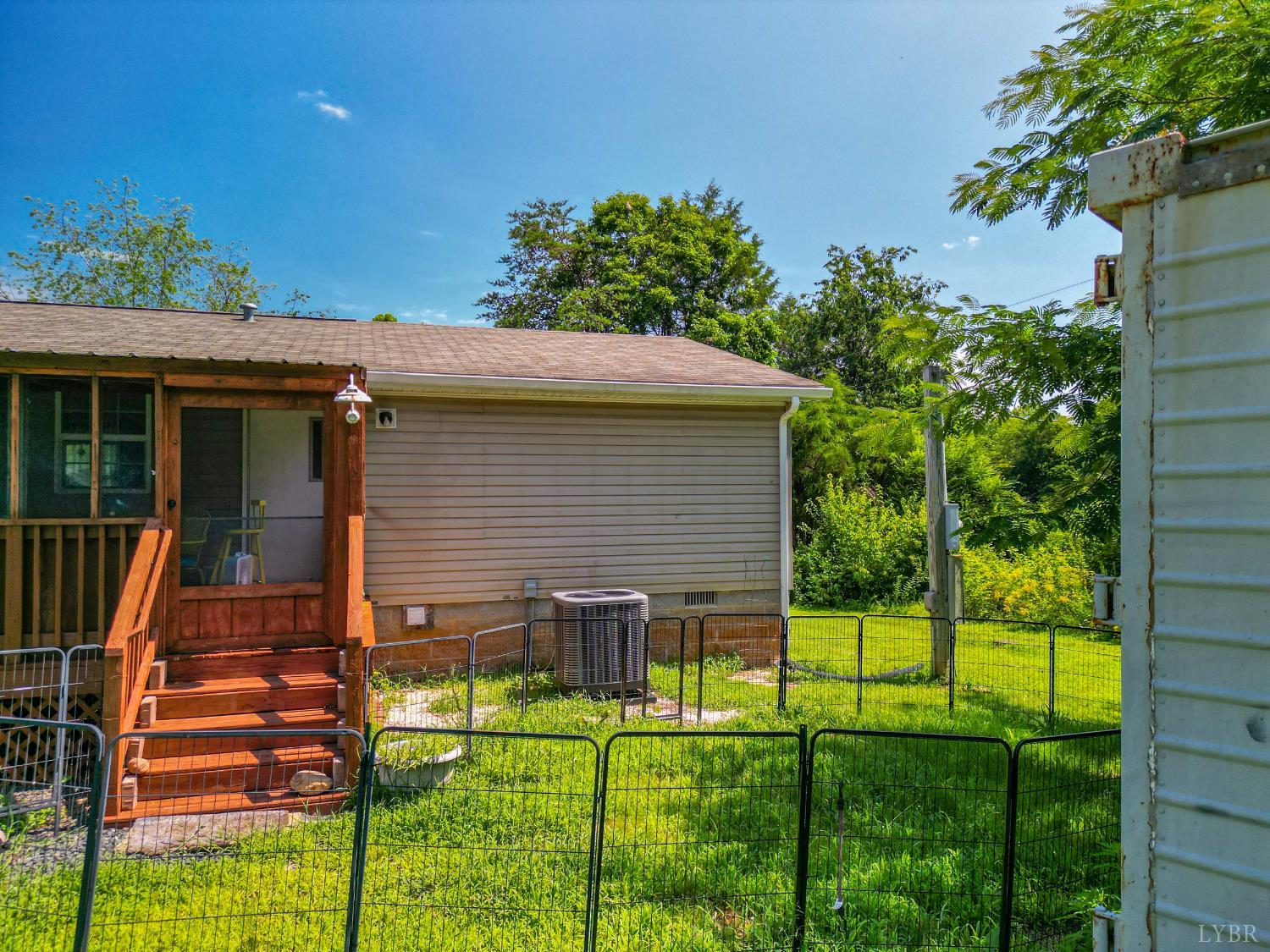 456 Shirey Farm Road Spout Spring, VA 24593 - Photo 54 of 63 a view of a house with backyard and a garden