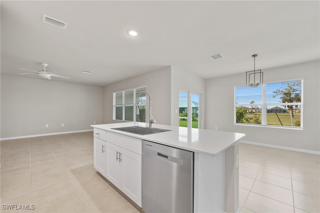 16039 Quinta Drive Punta Gorda, FL 33955 - Photo 15 of 48 a view of kitchen with center island and stainless steel appliances