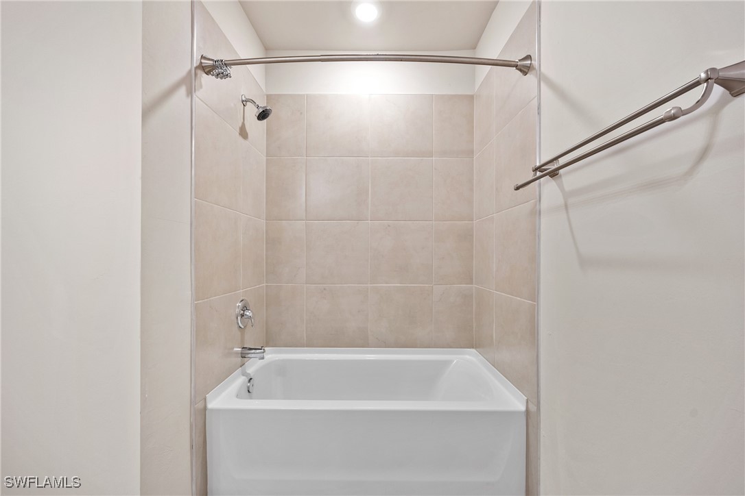 16039 Quinta Drive Punta Gorda, FL 33955 - Photo 29 of 48 a bathroom with a bath tub and shower