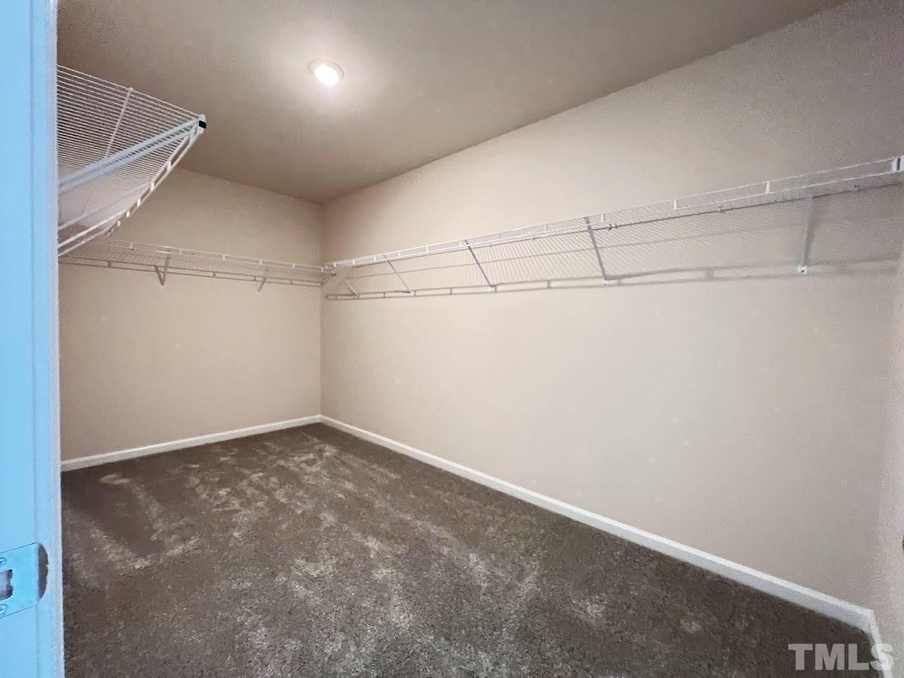 4812 Trikala Avenue Raleigh, NC 27603 - Photo 14 of 16 a view of a room with racks on the wall