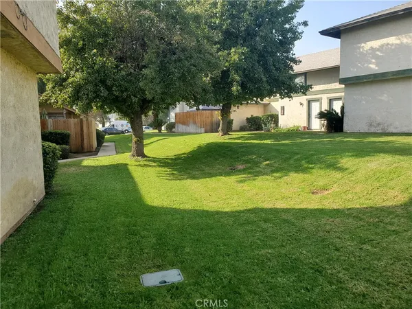 a view of a house with a big yard