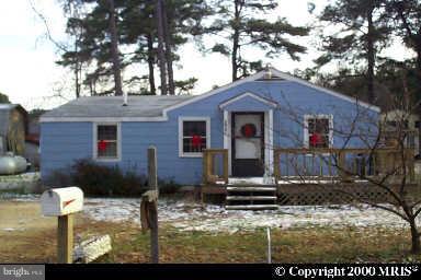 38191 Dukeharts Coltons Point, MD 20626 - Photo 1 of 1 a front view of a house with garden
